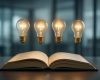 An open book with light bulbs hovering above it, symbolizing ideas and inspiration.